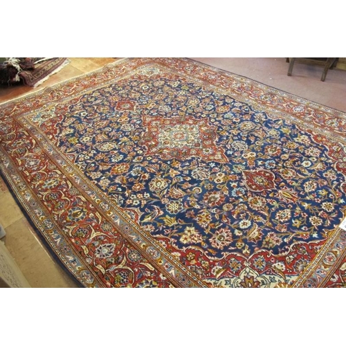 949 - A fine central Persian Kashan carpet. central motif on blue ground and in excellent condition. 335 x... 