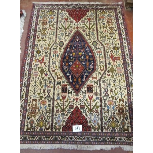 951 - A Persian design rug, with central motif and highly decorated with stylised animals. 148 x 211 cm (n... 