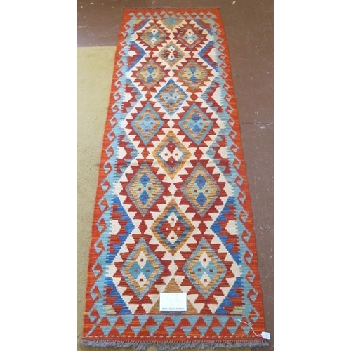 954 - A Chobi Kilim runner, good colours and excellent condition. 204cm x 68cm.