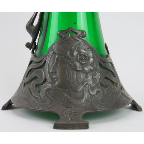 111 - A large WMF Art Nouveau pewter and green glass claret jug designed by Albert Mayer, circa 1900. Cast... 