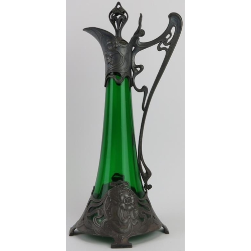 111 - A large WMF Art Nouveau pewter and green glass claret jug designed by Albert Mayer, circa 1900. Cast... 