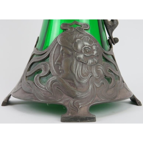 111 - A large WMF Art Nouveau pewter and green glass claret jug designed by Albert Mayer, circa 1900. Cast... 