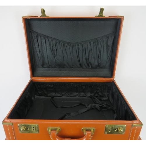 139 - A graduated set of three light brown leather travel suitcases, mid 20th century. (3 items). 
Conditi... 