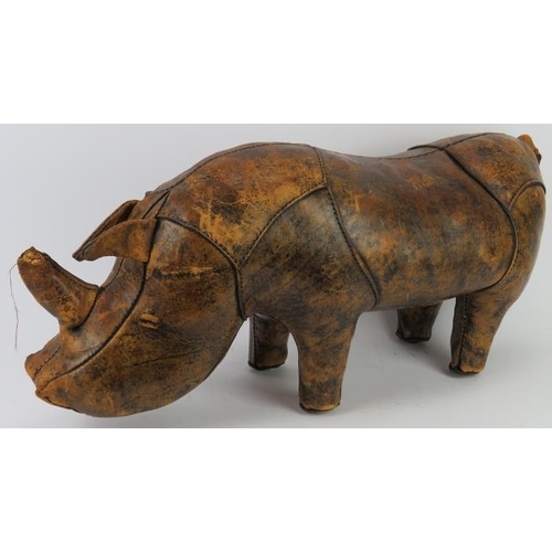 175 - A stitched brown leather straw stuffed rhino foot stool modelled in the manner of examples by Libert... 