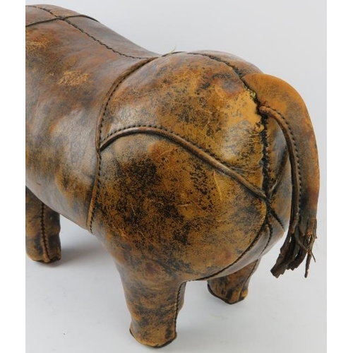 175 - A stitched brown leather straw stuffed rhino foot stool modelled in the manner of examples by Libert... 