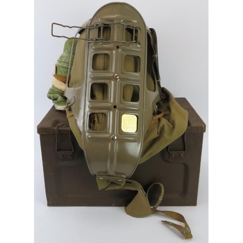 182 - A WWII baby’s protective helmet and respirator together with two ammunition boxes. Ammunition boxes ... 