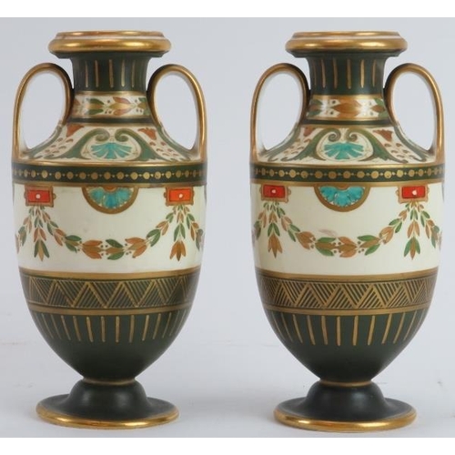 2 - A pair of Wedgwood neoclassical style gilt and polychrome painted twin handled urns, circa 1878. Fac... 