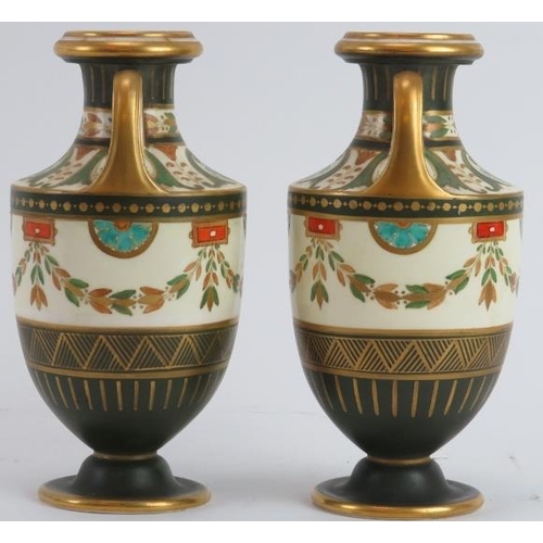 2 - A pair of Wedgwood neoclassical style gilt and polychrome painted twin handled urns, circa 1878. Fac... 