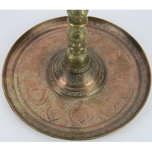 211 - A large Middle Eastern copper and brass astray on stand, late 19th/early 20th century. With finely e... 