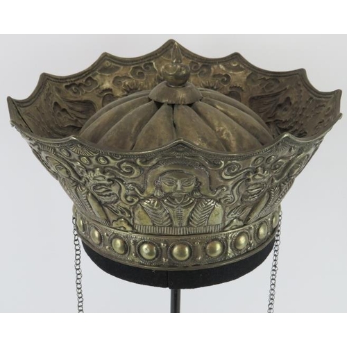 218 - A Chinese parcel gilt silver ceremonial crown, late 19th/early 20th century. Embossed with a central... 