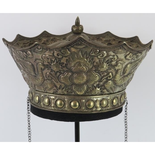 218 - A Chinese parcel gilt silver ceremonial crown, late 19th/early 20th century. Embossed with a central... 