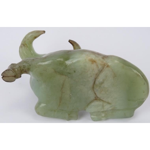 220 - New description:  A Chinese celadon jade carving of a recumbent water buffalo, 20th century. Support... 