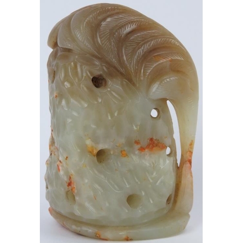 221 - A Chinese pale green and russet jade carving of a deer amongst foliage, 20th century. 9 cm height. P... 