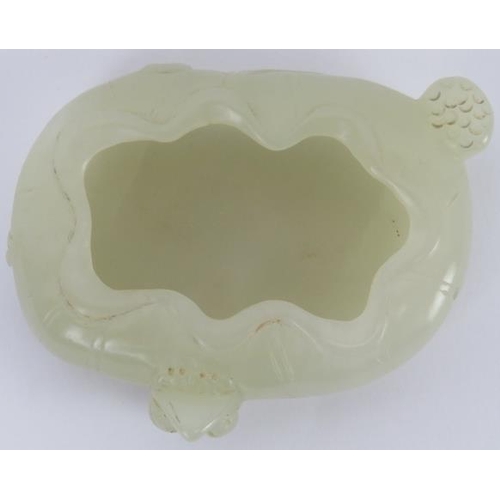 224 - A Chinese pale celadon jade brush washer cup, early 20th century. Carved in the form of a furled lot... 