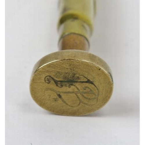 233 - A novelty Royal Marines Light Infantry brass bullet seal, early 20th century. Applied with the insig... 