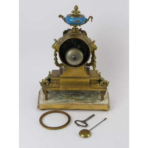 236 - A French ormolu and porcelain mantle clock, 19th century. Modelled in the Neoclassical style with ha... 