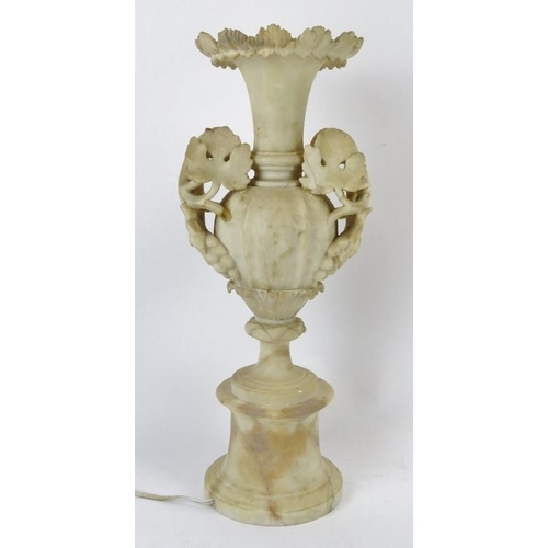 238 - A large alabaster illuminated urn table lamp. 49.8 cm height. Condition report: Some wear chips and ... 