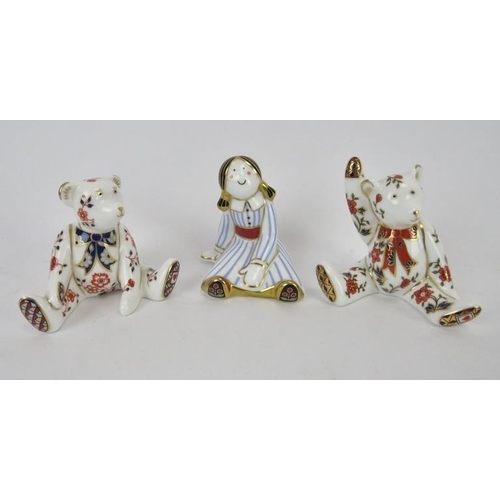 252 - Three Royal Crown Derby porcelain toy figurines. Comprising two bears and a doll. (3 items).