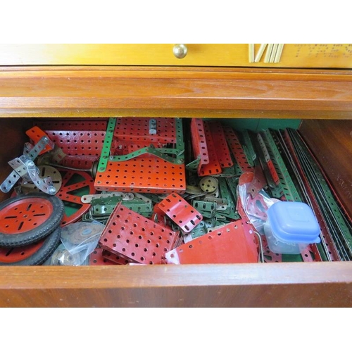 256 - A bespoke cabinet housing large collection of Meccano. The upper eight draws comprehensively named a... 