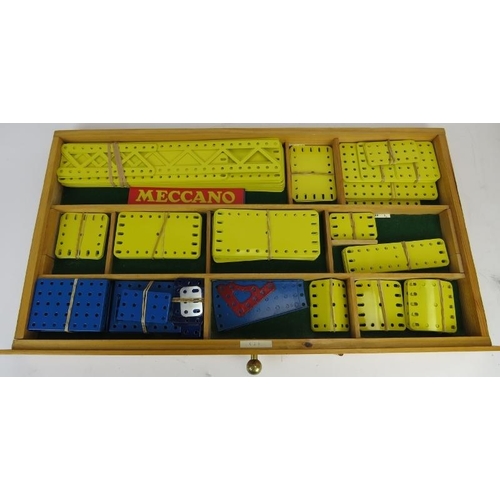 256 - A bespoke cabinet housing large collection of Meccano. The upper eight draws comprehensively named a... 