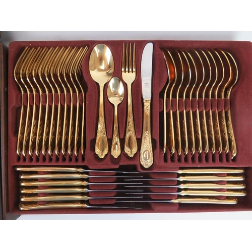 27 - An SBS Bestecke Solingen 23/24 Carat gold plated metal twelve place setting flatware set, late 20th ... 