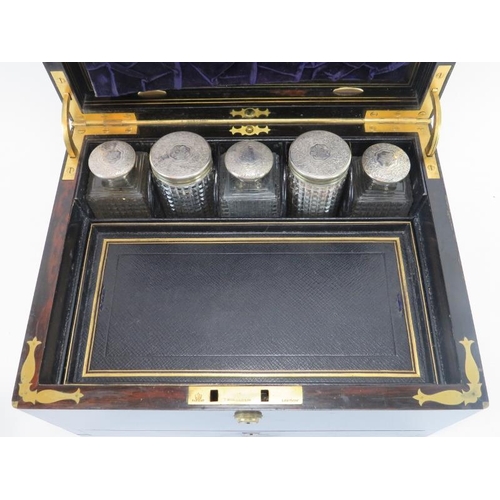 300 - A mid Victorian rosewood and silver mounted glass travelling dressing table set, mid 19th century. F... 