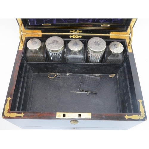 300 - A mid Victorian rosewood and silver mounted glass travelling dressing table set, mid 19th century. F... 