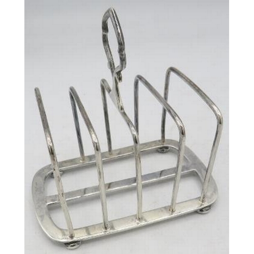 310 - A four divisional silver toast rack, Birmingham 1946, approx weight 4.4 troy oz/137 grams.
Condition... 