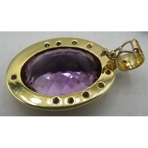 356 - An 18ct yellow gold pendant set with large amethyst, approx 25mm x 18mm and surrounded by 12 slightl... 