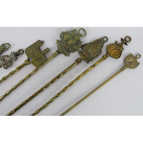 36 - A group of nine brass and metal toasting forks, Victorian and later. (9 items) Longest fork: 51 cm l... 