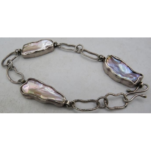 381 - A handmade silver & Baroque pearl bracelet, consisting of three silver cased pearls each approx 25mm... 