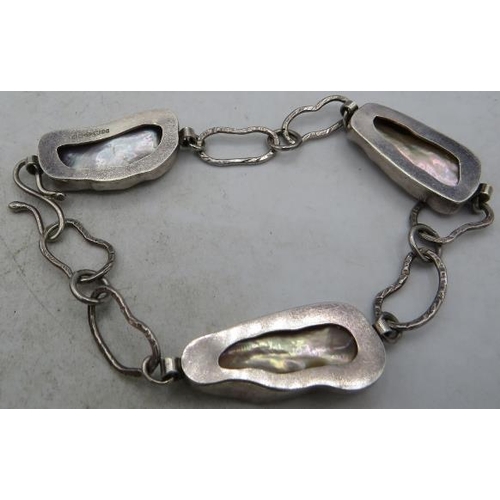 381 - A handmade silver & Baroque pearl bracelet, consisting of three silver cased pearls each approx 25mm... 