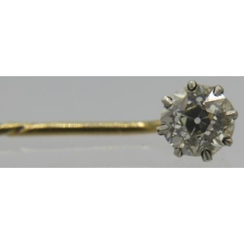 382 - A round brilliant cut diamond stick pin. Approx 0.60 carats on yellow metal pin. 
Condition report: ... 