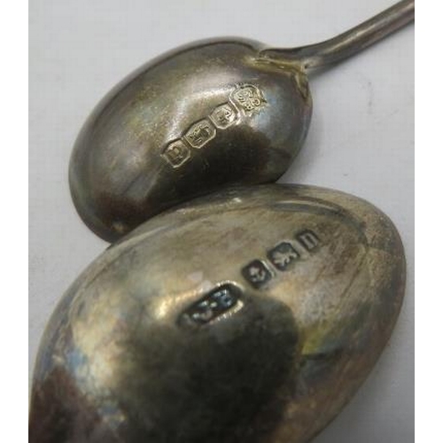 393 - A set of six silver coffee spoons with decorated handles. B'ham 1912 and a set of six silver coffee ... 