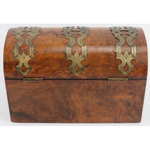 40 - A Victorian brass mounted burr walnut veneered tea caddy. The domed cover with pierced brass mounted... 