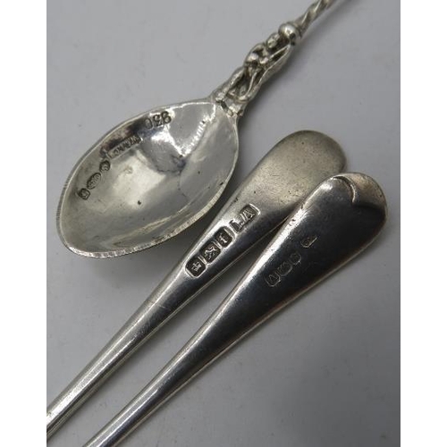 447 - An assortment of items. To include a pair of silver sugar tongs, B'ham 1906. Two silver butter knive... 