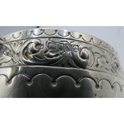 452 - A silver Victorian two handled porringer embossed with scrolls & half fluting decoration, engraved '... 