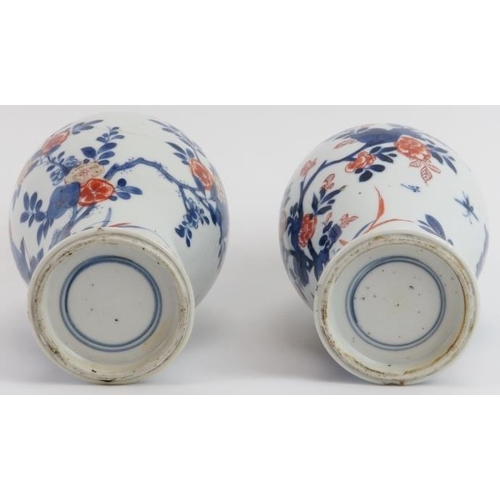 48 - Two Chinese Imari decorated and gilt highlighted porcelain vases, 19th century. The matched pair of ... 