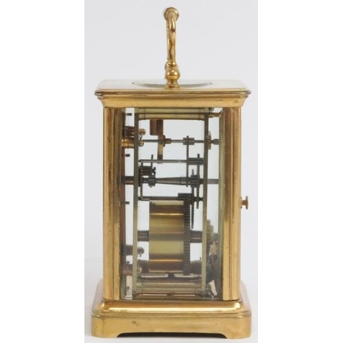 52 - A Swiss gilt brass cased carriage clock, 19th century. With a foliate engraved gilt mask, cream enam... 