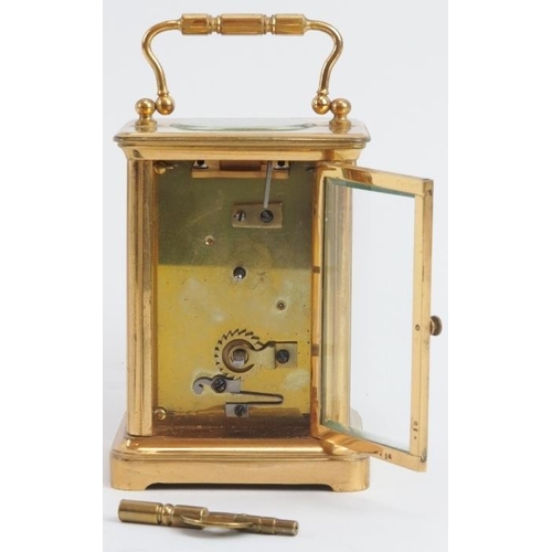 52 - A Swiss gilt brass cased carriage clock, 19th century. With a foliate engraved gilt mask, cream enam... 