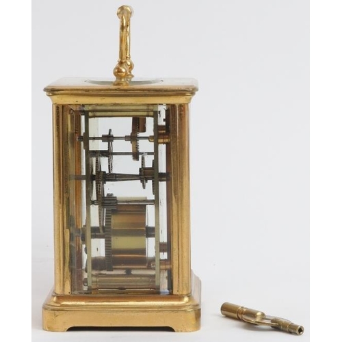 52 - A Swiss gilt brass cased carriage clock, 19th century. With a foliate engraved gilt mask, cream enam... 