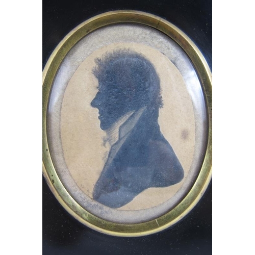 597 - British School (19th century) - 'Portrait of a Gentleman', silhouette miniature, 6cm x 5cm oval, ins... 