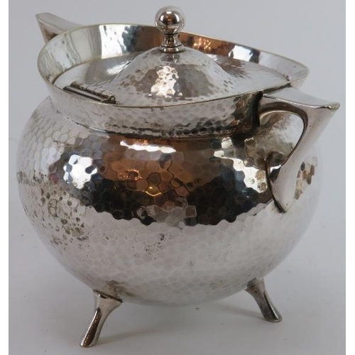 6 - A Mappin & Webb silver plated spot hammered tea caddy designed by Christopher Dresser, late 19th cen... 