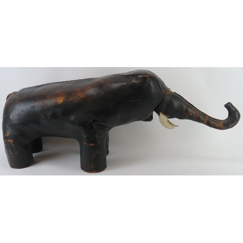 71 - A stitched brown leather straw stuffed elephant foot stool modelled in the manner of examples by Lib... 