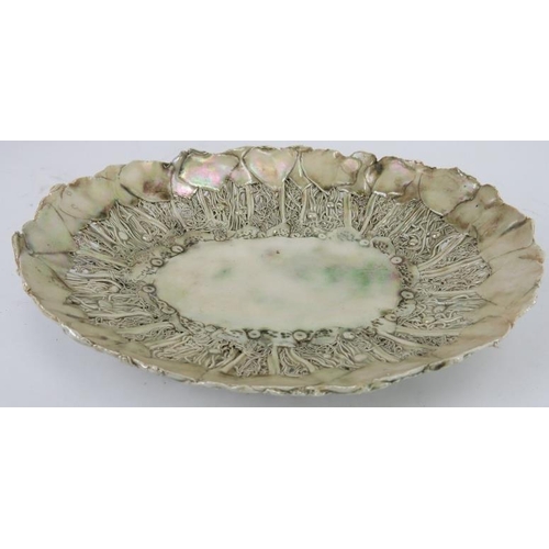 82 - An unusual iridescent pale green majolica bowl, late 19th/early 20th century. Marked EB to the rever... 