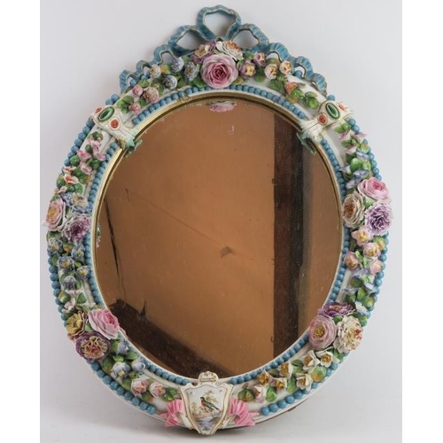 83 - A European Meissen porcelain wall mirror with applied Barbotine floral decoration modelled in relief... 