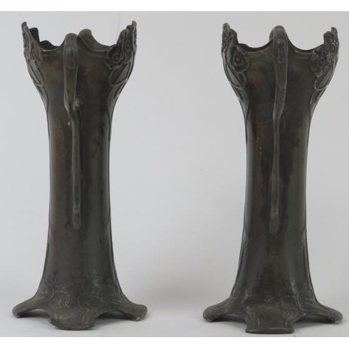 97 - A matched pair of WMF Art Nouveau pewter twin handled vases, early 20th century. Both struck with WM... 