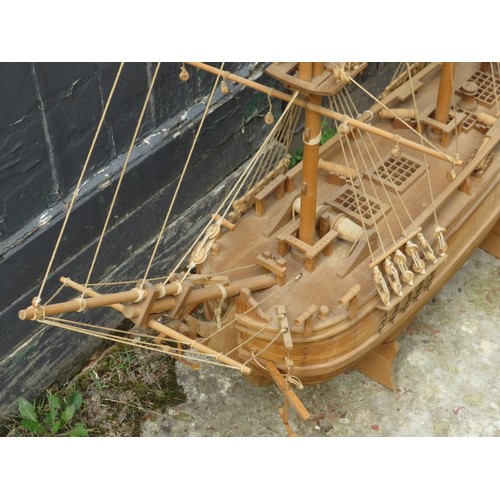 37 - A large carved wood model of a galleon ship, late 20th century. 121 cm height on stand. 
Condition r... 