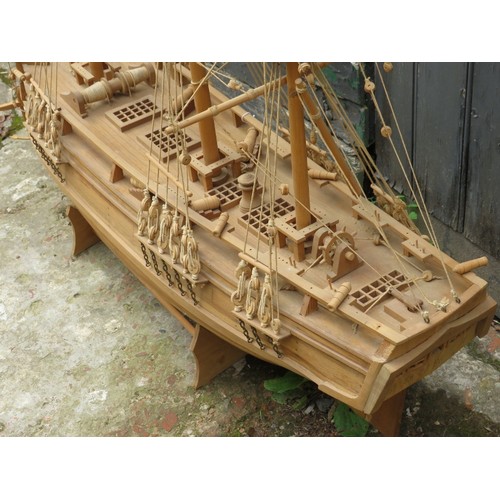 37 - A large carved wood model of a galleon ship, late 20th century. 121 cm height on stand. 
Condition r... 