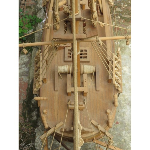 37 - A large carved wood model of a galleon ship, late 20th century. 121 cm height on stand. 
Condition r... 